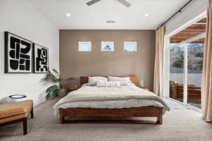 Carpeted primary bedroom featuring access to exterior, recessed lighting, and ceiling fan