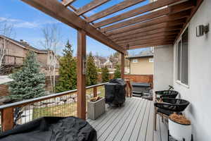 Deck featuring grilling area and a hot tub