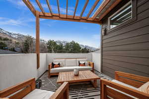 Balcony with outdoor seating and a mountain view