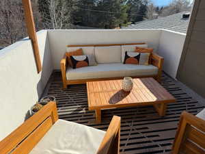 Balcony with outdoor lounge area off primary BR