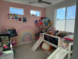 Bedroom featuring carpet floors and ceiling fan