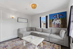 Living room with baseboards and wood finished floors