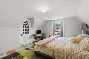Large upstairs bedroom with a lofted ceiling and big enough for a king bed.