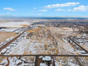 Snowy aerial view featuring a residential view