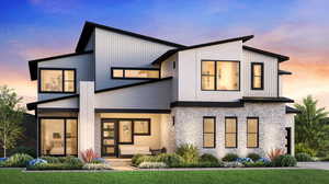 Back of house featuring stone siding and a yard