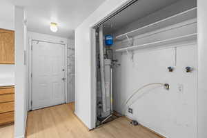 Utility room featuring water heater