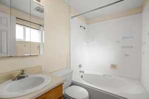 Full bathroom featuring vanity and shower / bath combination