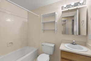Bathroom featuring vanity and bathing tub / shower combination