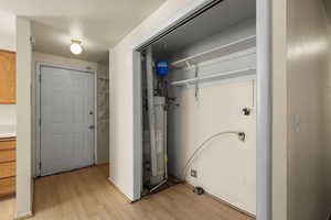 Utility room featuring water heater