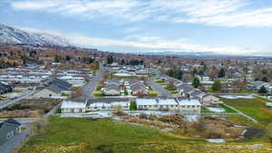 Aerial perspective of suburban area with a mountainous background