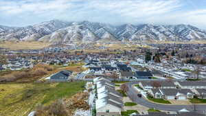 Aerial perspective of suburban area with a mountainous background