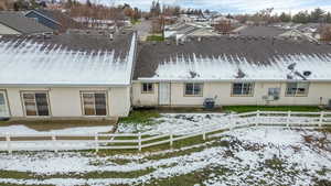 rear of property featuring a fenced backyard, a patio, and a residential view