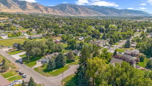 Aerial perspective of suburban area featuring a mountain backdrop