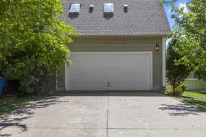 Garage featuring driveway
