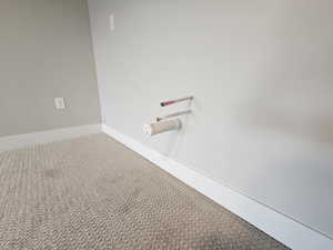 Detailed view of baseboards and carpet