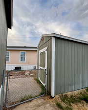 View of shed with a gate