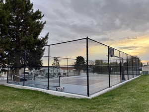 View of tennis court with community basketball court