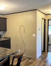 Dining area with dark wood finished floors and a textured ceiling