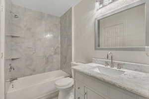 Full bathroom featuring vanity and shower / washtub combination