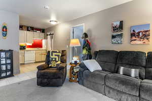 Living room with light tile patterned flooring