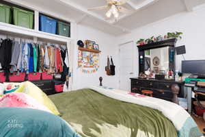 Bedroom featuring a closet, beam ceiling, and ceiling fan