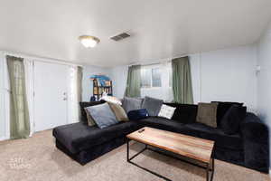 Living area with carpet flooring