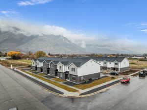 Aerial view of residential area with a mountainous background