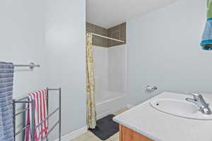 Primary Bathroom with Tub and Shower