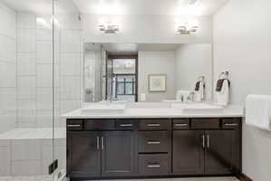 Double vanity with vessel sinks and dark wood-finish cabinetry