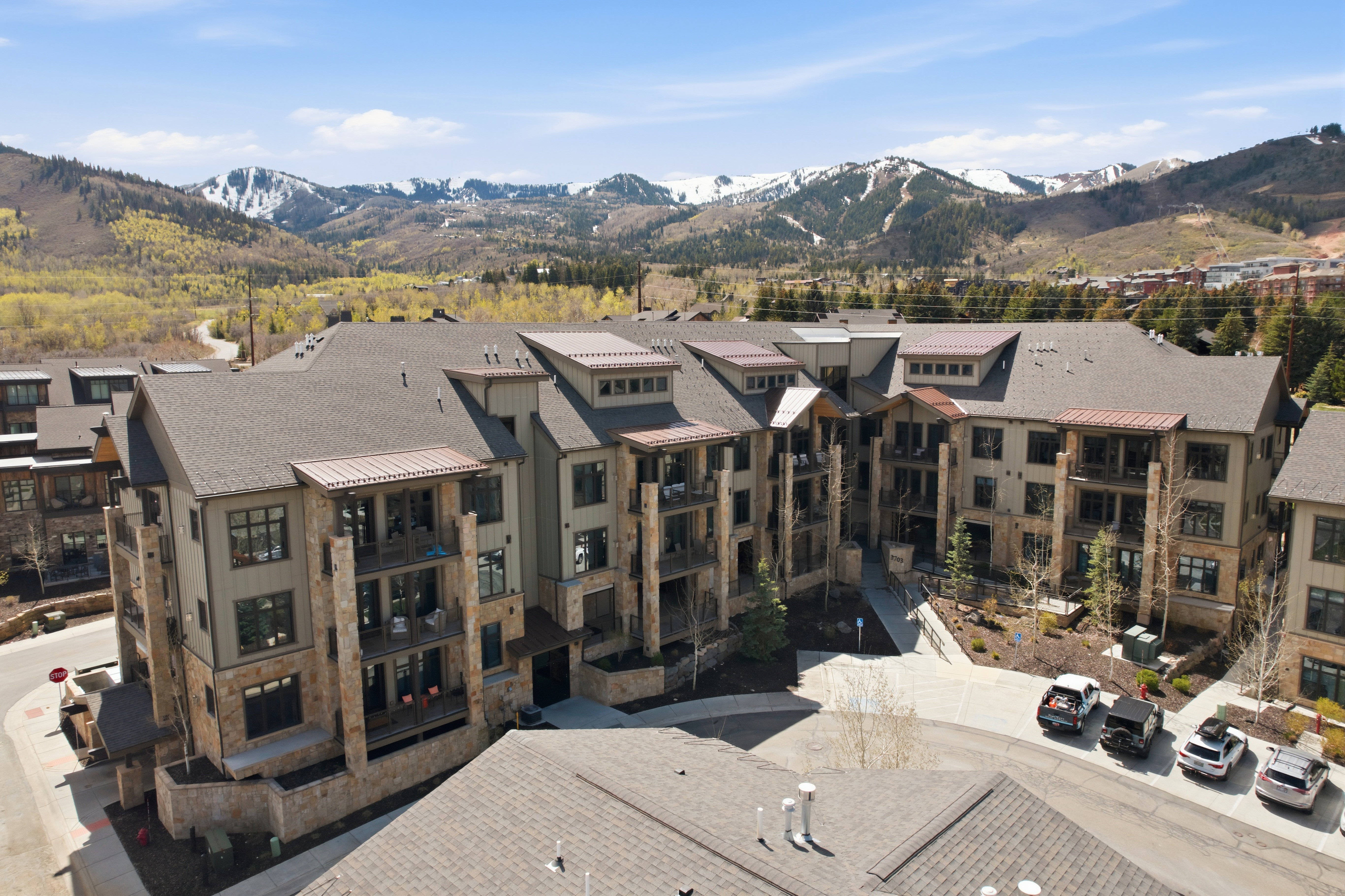 Multi-story building featuring stone and siding exterior construction