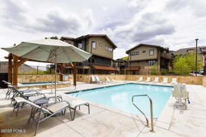 Community pool featuring a patio
