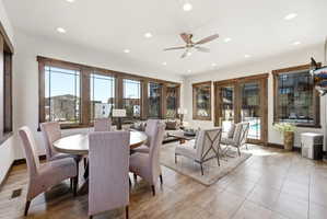 Open-concept living space featuring wood-finish window and door trim