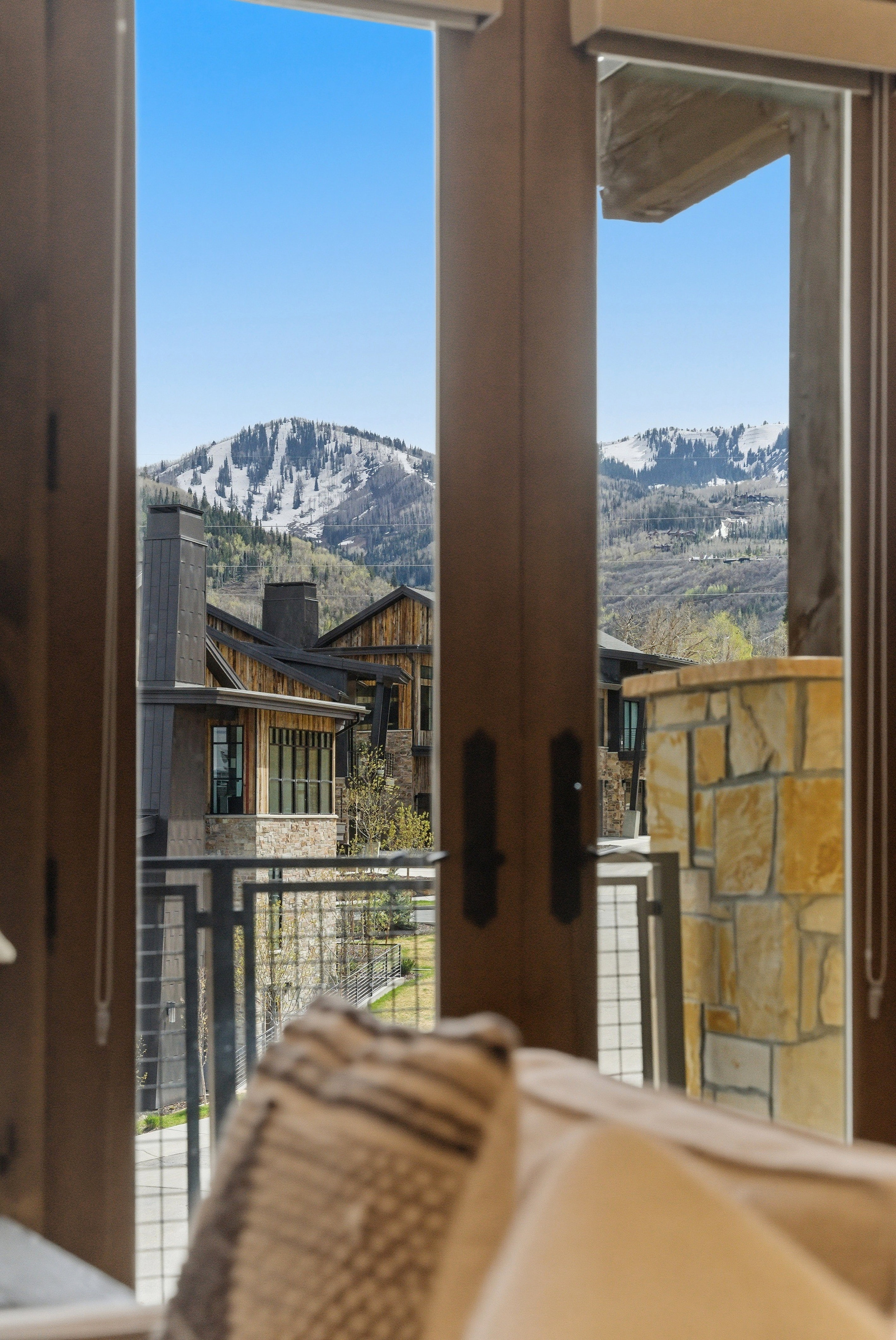 Mountain scenery framed by double doors