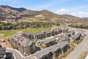 Residential development featuring multi-story buildings with pitched roofs and exterior balconies