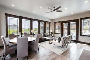 Dining space with recessed lighting, ceiling fan, and light tile patterned flooring