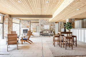 Community lobby with a wood ceiling with exposed beams