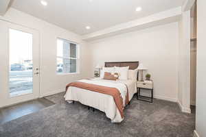 Bedroom featuring dark carpet, access to outside, and recessed lighting