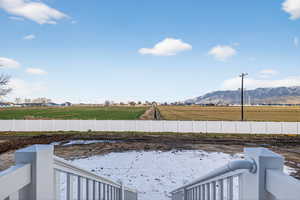 Fenced yard with a rural view