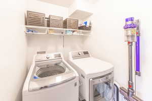 Laundry room with washing machine and dryer