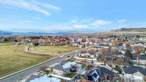 Aerial view of residential area featuring a mountain backdrop