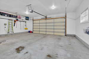 Garage featuring a garage door opener