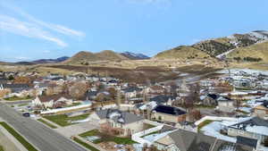 Aerial view of residential area featuring a mountain backdrop