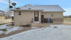 View of front of house with brick siding and stucco siding