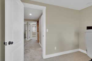 Unfurnished room with light colored carpet