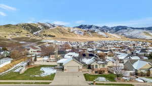 View of mountain backdrop featuring nearby suburban area