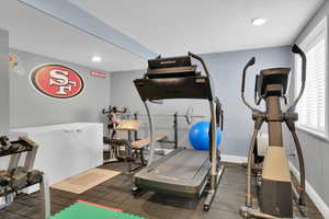 Exercise room featuring recessed lighting and dark rubber floors