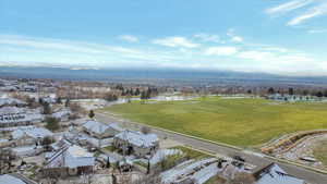 Overview of rural landscape featuring a mountain backdrop