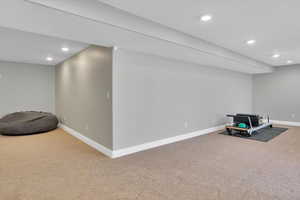 Finished basement featuring carpet flooring and recessed lighting