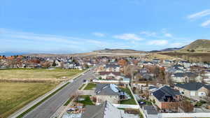 Aerial overview of property's location with nearby suburban area and a mountain backdrop