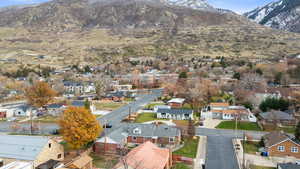 Aerial perspective of suburban area featuring a mountainous background
